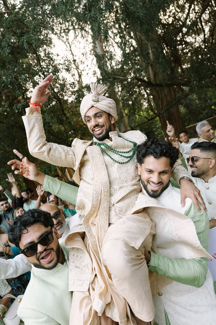 Groom lifted on his friends' shoulders at his Baraat