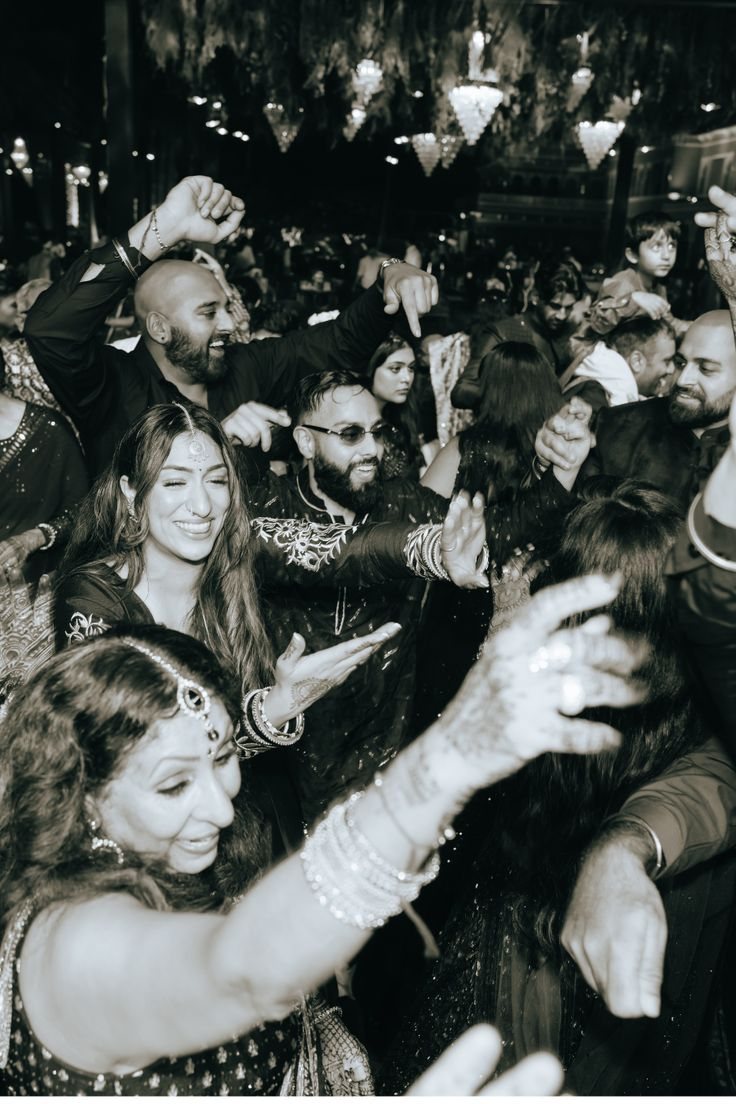 Family and friends dancing together at a Sher wedding night