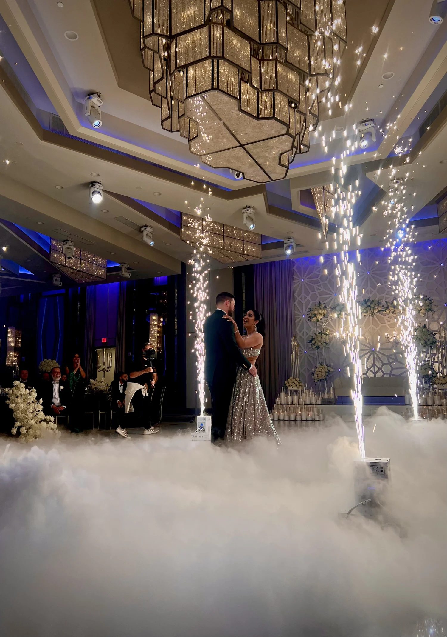 Couple dancing between cold spark fountains