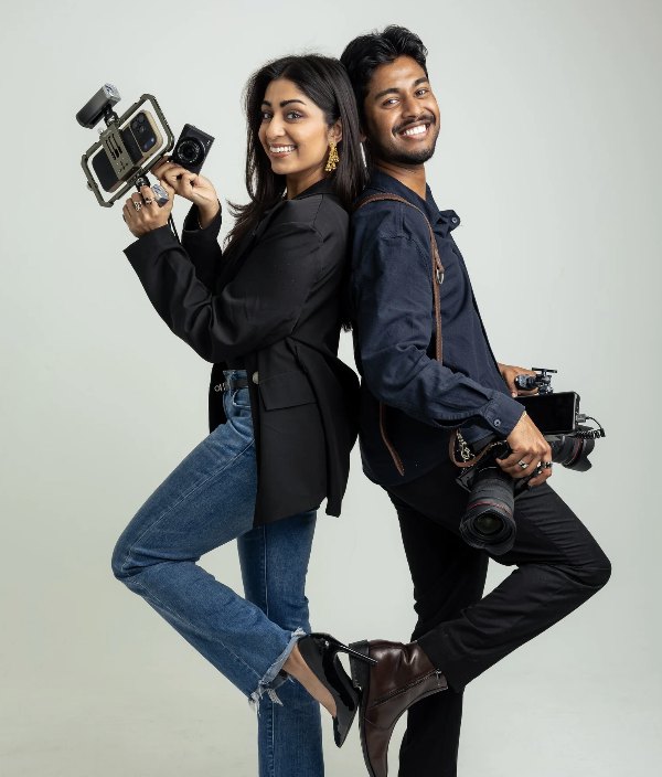 Suhani Parikh and Jay Pinheiro of House of Chaos holding their cameras